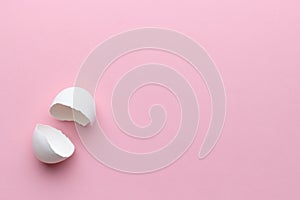 Egg shell on pink background copy space. Happy easter concept