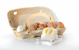 Egg slicer with a box of eggs