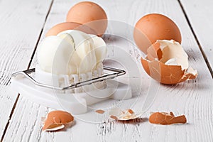 Egg slicer - cutter on white table