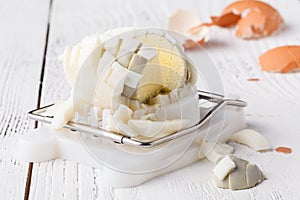 Egg slicer - cutter on white table