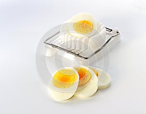 An egg slicer and sliced â€‹â€‹egg