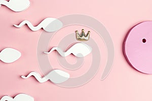 Egg and sperm in a crown on a pink background