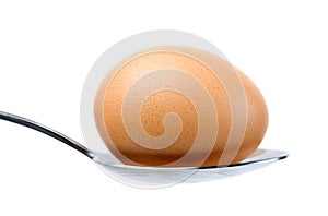 Egg on a spoon photo