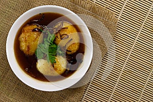 Egg with Tamarind Sauce on wooden background