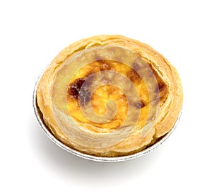 Egg tart in aluminum foil cup isolated on white background