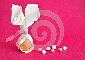 An egg tied in a serviette that looks like bunny ears