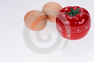 Egg timer mockup in the form of a tomato with two eggs