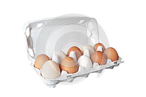 Egg tray with fresh brown eggs isolated on white background. Fresh organic chicken eggs in carton box