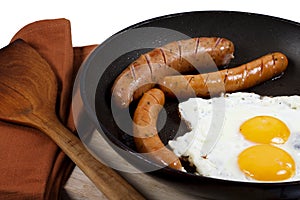 Egg and veal sausage breakfast isolated