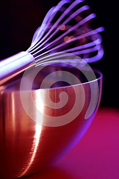 Egg whisk and metal bowl