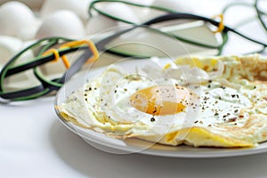 egg white omelette plate with resistance bands in soft focus