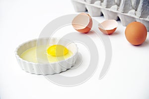 Egg yoke and shells with egg carton