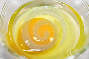 Egg yolk in clear glass bowl