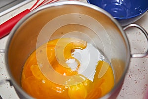 Egg yolks and sugar in a pot