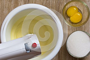 Egg yolks are whisked with sugar in mixer bowl