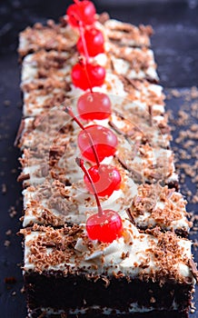 Eggless Creamy Blackforest cake slices in a tray