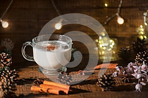 Eggnog Christmas drink on wooden background