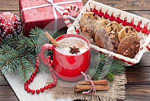 Eggnog cocktail in mug arranged with christmas decoration and c