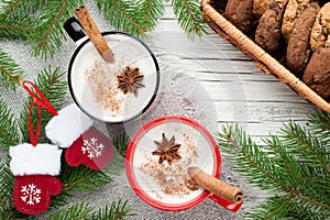 Eggnog cocktail in mug arranged with christmas decoration and co