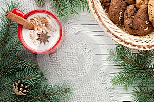 Eggnog cocktail in mug arranged with christmas decoration and co