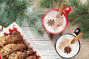 Eggnog cocktail in mug arranged with christmas decoration and co