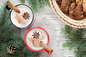 Eggnog cocktail in mug arranged with christmas decoration and co