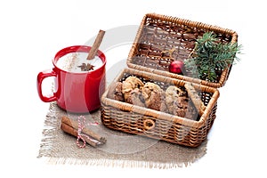 Eggnog cocktail in red mug arranged with christmas decoration an