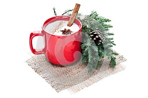 Eggnog cocktail in red mug arranged with christmas decoration is