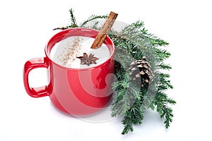 Eggnog cocktail in red mug arranged with christmas decoration is