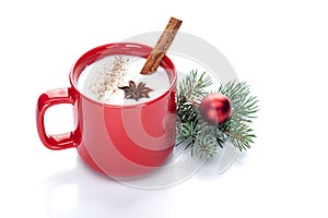 Eggnog cocktail in red mug arranged with christmas decoration