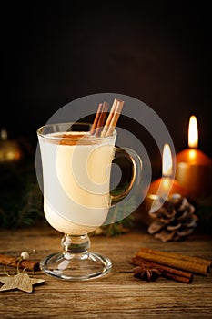 Eggnog - egg and cinnamon milk cocktail for Christmas and winter holidays