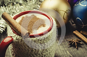 eggnog in a mug and Christmas decoration/eggnog in a mug and Christmas decoration. Selective focus