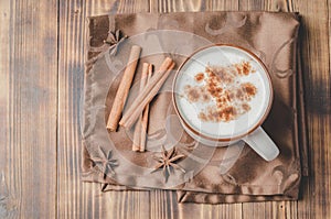 Eggnog. Traditional christmas cocktail and cinnamon sticks on wooden table. Top view