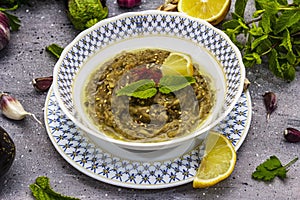 Eggplant dip baba ganoush mutabbal or mezze with ripe vegetables and fresh herbs