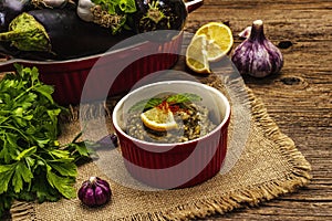 Eggplant dip baba ganoush mutabbal or mezze with ripe vegetables and fresh herbs