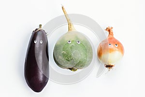 Eggplant, green radish and leek with cartoon eyes on white background