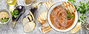 Eggplant hummus with ingredients for cooking. Traditional vegan arabic aubergine appetizer. Baba Ghanoush photo