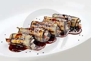 Eggplant rolls with eel. Isolated on a white background