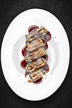 Eggplant rolls with eel. Isolated on a white background
