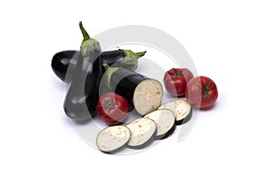 Eggplant with small tomatoes. Eggplants isolated on white background with tomatoes