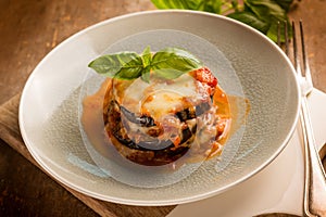 eggplants parmigiana with basil leaves