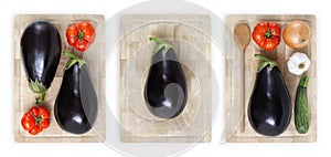 eggplants, tomatoes, zucchini, garlic and onion on wooden cutting board isolated on white banner parmigiana concept