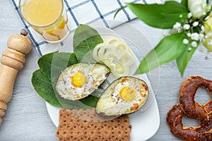 Eggs baked in avocado on plate