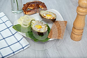 Eggs baked in avocado on plate