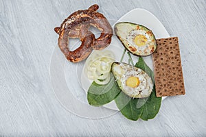 Eggs baked in avocado on plate