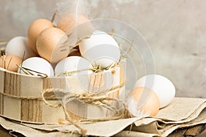 Eggs in a basket. top view of eggs in bowl. Brown eggs in wooden bowl. Chicken Egg. Hen eggs basket
