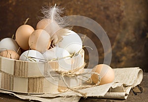 Eggs in a basket. top view of eggs in bowl. Brown eggs in wooden bowl. Chicken Egg. Hen eggs basket