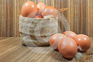 Eggs in basket on wood.eggs.egg.brown.rawfood