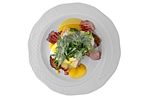 Eggs Benedict. Breakfast dish, which is a sandwich made from two halves of a bun with poached eggs, ham or bacon