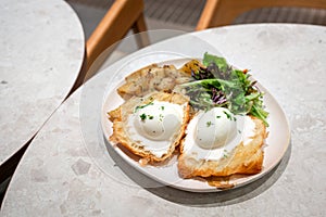 Eggs Benedict breakfast in a restaurant